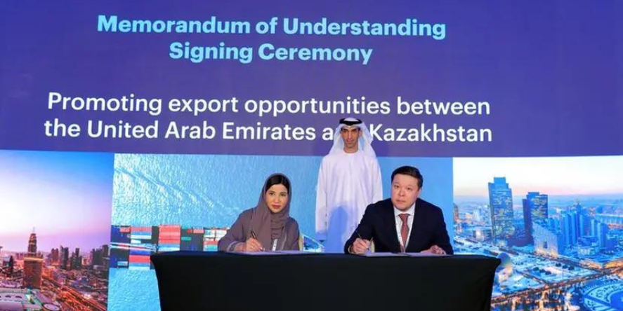 H.E. Raja Al Mazrouei, Chief Executive Officer of ECI, and Aslan Kaligazin, Chairman of KazakhExport signing the agreement.