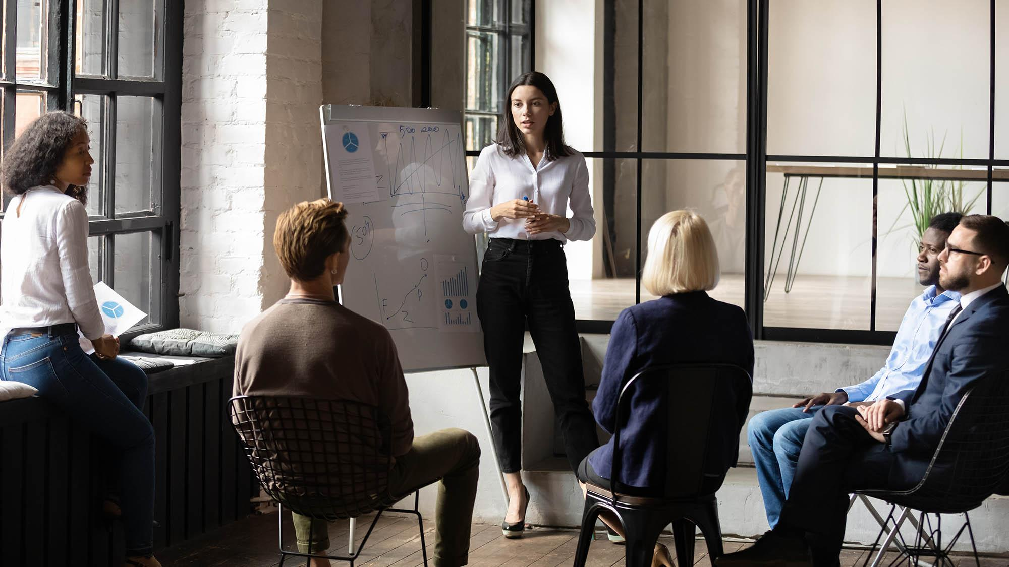 Career coaching session in a modern office in dubai with diverse professionals.