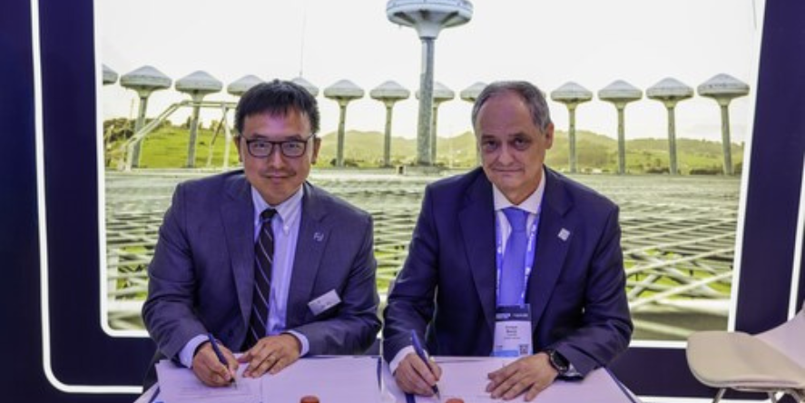 Jia Xu, Chief Executive Officer of SkyGrid, and Enrique Maurer, Director General of ENAIRE, sign a Memorandum of Understanding at Airspace World 2026 in Lisbon. Image Courtesy-SkyGrid