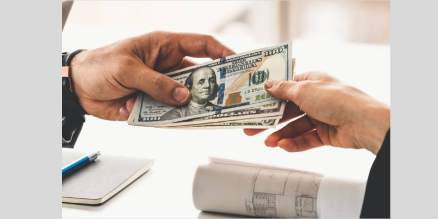 Cash to Cash transfer through hand. Image Credit-Istock photo
