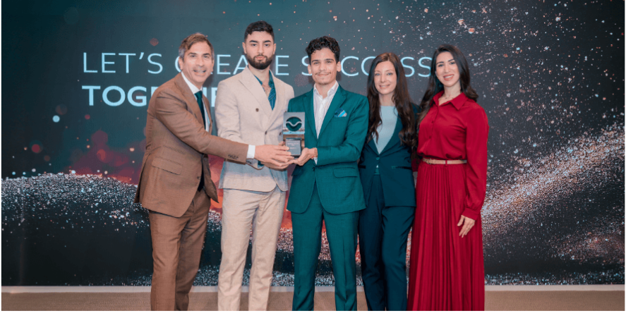 The GenZone team receiving the Dubai Free Zone Platinum Award for outstanding performance and commitment to client success
