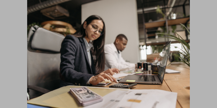 Two Individuals doing Accounts Payable Process in a Financial Firm. Image Courtesy- Pavel Danilyuk from Pexels.