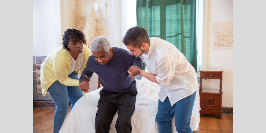 Man and Woman helding hand for an elderly woman to stand up. Image Courtesy-Image by Kampus productions in Pexels